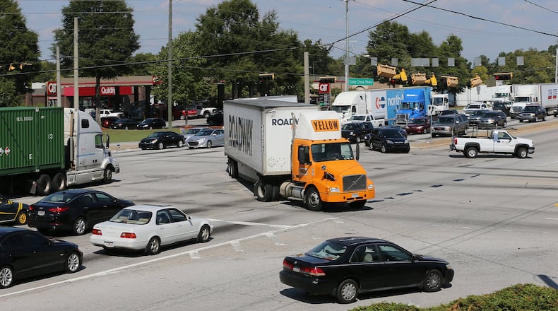 A vibrant flow of traffic fills Fulton Industrial Boulevard at Camp Creek Parkway corridor. Curtis Compton /ccompton@ajc.com AJC FILE PHOTO
