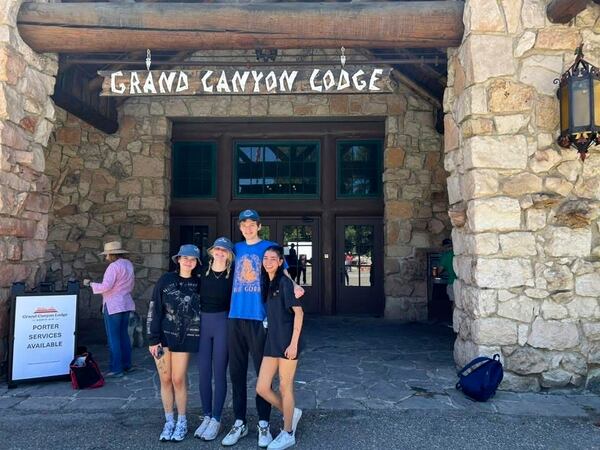 In this photo provided by Jen Pinegan, is her family standing in front of the Grand Canyon Lodge during the Fourth of July weekend, on the North Rim of Grand Canyon National Park, in northern Arizona, July 2025. (Jen Pinegan via AP)