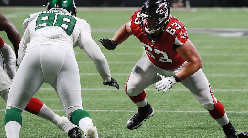 Falcons guard Chris Lindstrom blocks New York Jets defensive lineman Kyle Phillips on a touchdown run by Ito Smith. Curtis Compton/ccompton@ajc.com