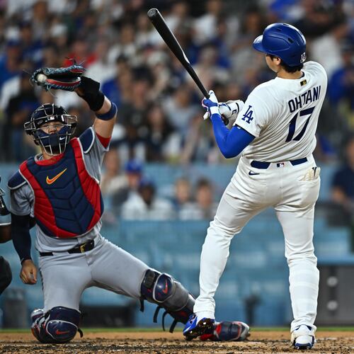 Los Angeles Dodgers' Shohei Ohtani (17) takes a close pitch during the second inning of a baseball game against the St. Louis Cardinals, Wednesday, Sept. 2, 2026, in Los Angeles. (AP Photo/William Liang)