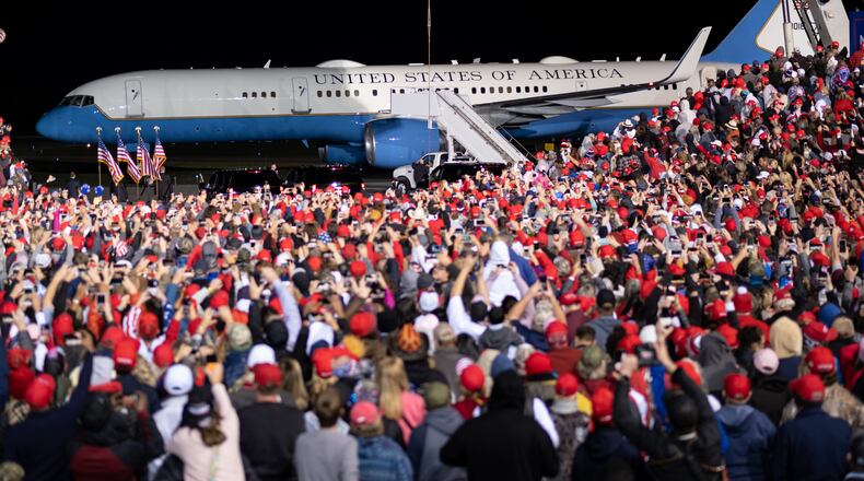 Supporters of President Donald Trump gathered for a campaign rally at the Richard B. Russell Airport in Rome on Nov. 1, despite an order by Gov. Brian Kemp banning gatherings of 50 people or more without distancing measures. (PHOTO by Ben Gray for the Atlanta Journal-Constitution)