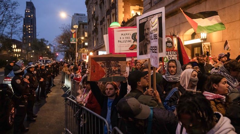 Pro-Palestinian protesters demonstrate outside Columbia University in New York. (Adam Gray/The New York Times)