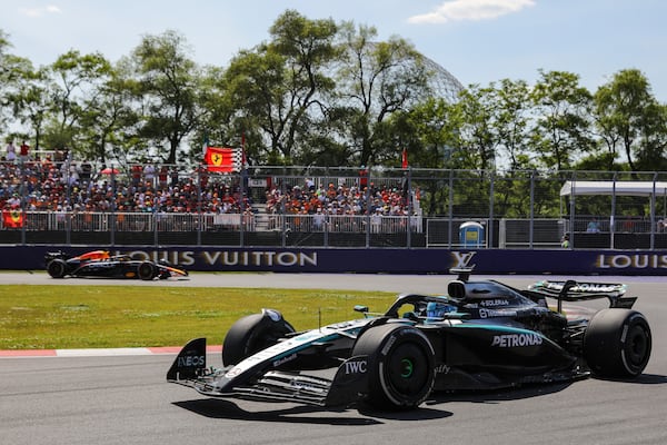 Mercedes driver George Russell, of the United Kingdom, leads Red Bull Racing driver Max Verstappen, of the Netherlands, through the hairpin during Formula One auto racing action at the Canadian Grand Prix, in Montreal on Sunday, June 15, 2025. (Evan Buhler/The Canadian Press via AP)