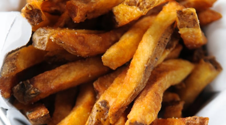 If you’re looking for a snack at Leon’s Full Service, try the Belgian frites with dipping sauces. BECKY STEIN / SPECIAL TO THE AJC
