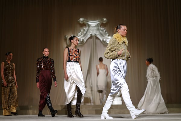 Models wear creations as part of the Chanel Fall-Winter 2025/26 Haute Couture collection presented Tuesday, July 8, 2025, in Paris. (AP Photo/Tom Nicholson)