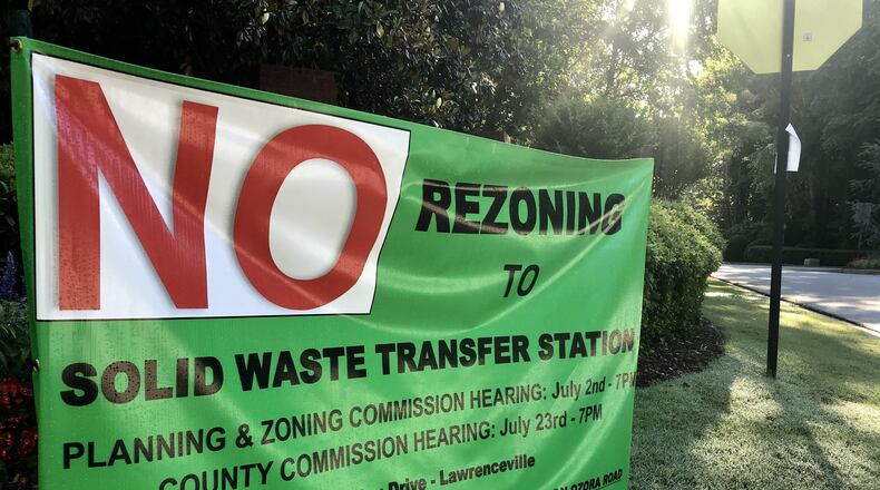A sign protesting the proposed Ozora Road Solid Waste Transfer Station, posted outside the Kensington Forest subdivision near Loganville. TYLER ESTEP / TYLER.ESTEP@AJC.COM