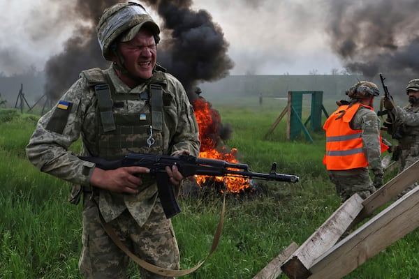 In this photo provided by Ukraine's 65th Mechanized Brigade press service, Ukrainian servicemen attend a military training in Zaporizhzhia region, Ukraine, Monday, May 26, 2025. (Andriy Andriyenko/Ukraine's 65th Mechanized Brigade via AP)