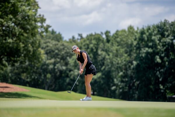 Ava Merrill of Johns Creek rolls a putt during the 2025 Georgia Women's Amateur, which she won.  (Kate Awtrey-King for the AJC)