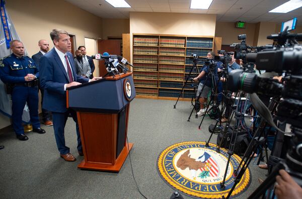 Acting U.S. Attorney Alexander C. Van Hook speaks during a press conference announcing the indictment of current and former police officers on fraud and conspiracy charges, Wednesday, July 16, 2025, at the Lafayette Federal Courthouse in Lafayette, La. (Brad Bowie/The Times-Picayune/The New Orleans Advocate via AP)