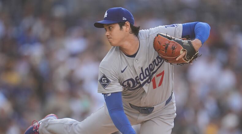 Los Angeles Dodgers starting pitcher Shohei Ohtani works against a San Diego Padres batter during the first inning of a baseball game Wednesday, May 20, 2026, in San Diego. (AP Photo/Gregory Bull)