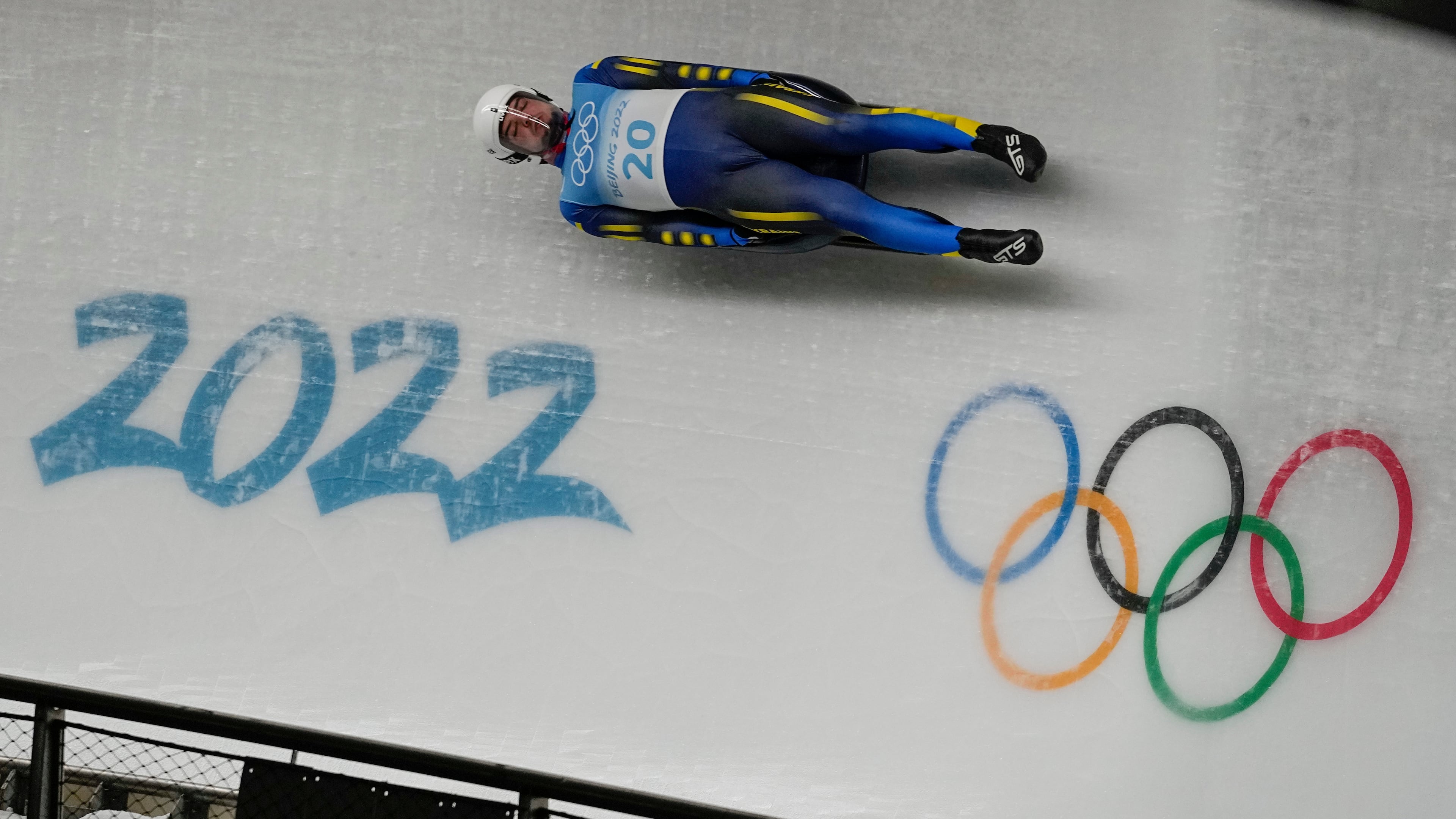 FILE -Anton Dukach, of Ukraine, slides during the luge men's single round 3 at the 2022 Winter Olympics, Feb. 6, 2022, in the Yanqing district of Beijing. (AP Photo/Pavel Golovkin, File)
