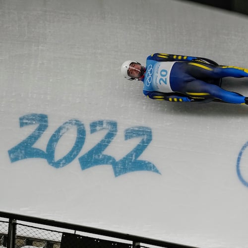 FILE -Anton Dukach, of Ukraine, slides during the luge men's single round 3 at the 2022 Winter Olympics, Feb. 6, 2022, in the Yanqing district of Beijing. (AP Photo/Pavel Golovkin, File)