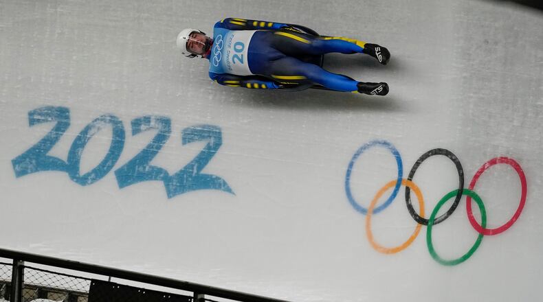 FILE -Anton Dukach, of Ukraine, slides during the luge men's single round 3 at the 2022 Winter Olympics, Feb. 6, 2022, in the Yanqing district of Beijing. (AP Photo/Pavel Golovkin, File)
