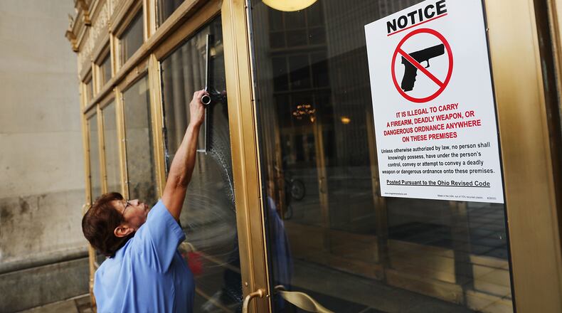 A sign on a door forbids people from carrying guns into a public building in Cleveland, Ohio. An estimated 50,000 people are expected in Cleveland, including hundreds of protesters and members of the media. The four-day Republican National Convention kicks off on July 18. Spencer Platt/Getty Images