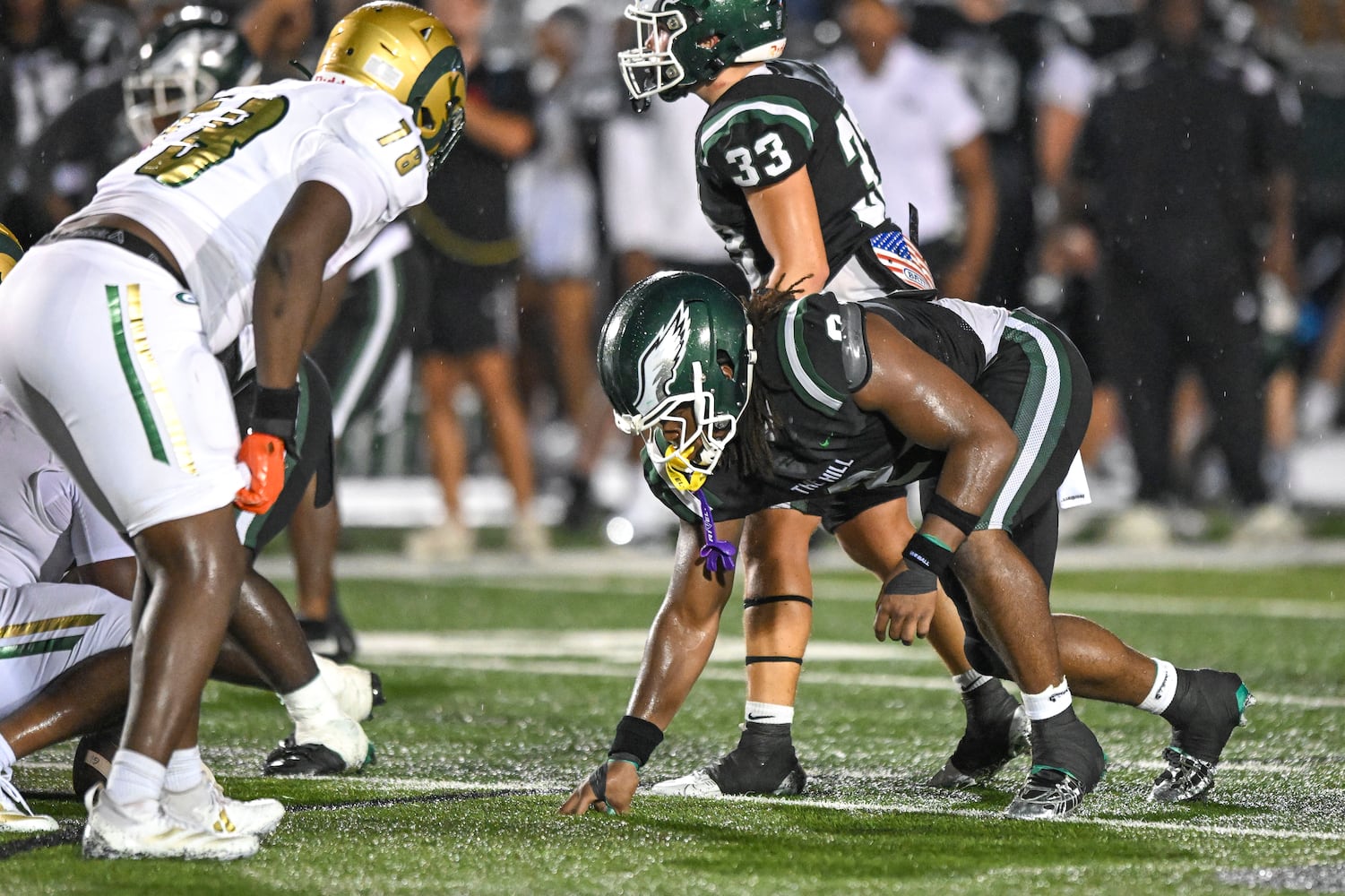 Collins Hill defensive end Deuce Geralds sets up against Grayson during the first half of play Friday, August 15, 2025. (Daniel Varnado for the AJC)