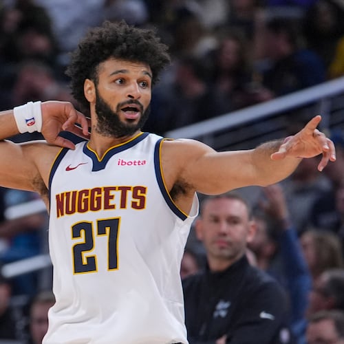 Denver Nuggets guard Jamal Murray (27) reacts after scoring his 50th point against the Indiana Pacers during the second half of an NBA basketball game in Indianapolis, Wednesday, Dec. 3, 2025. (AP Photo/Michael Conroy)