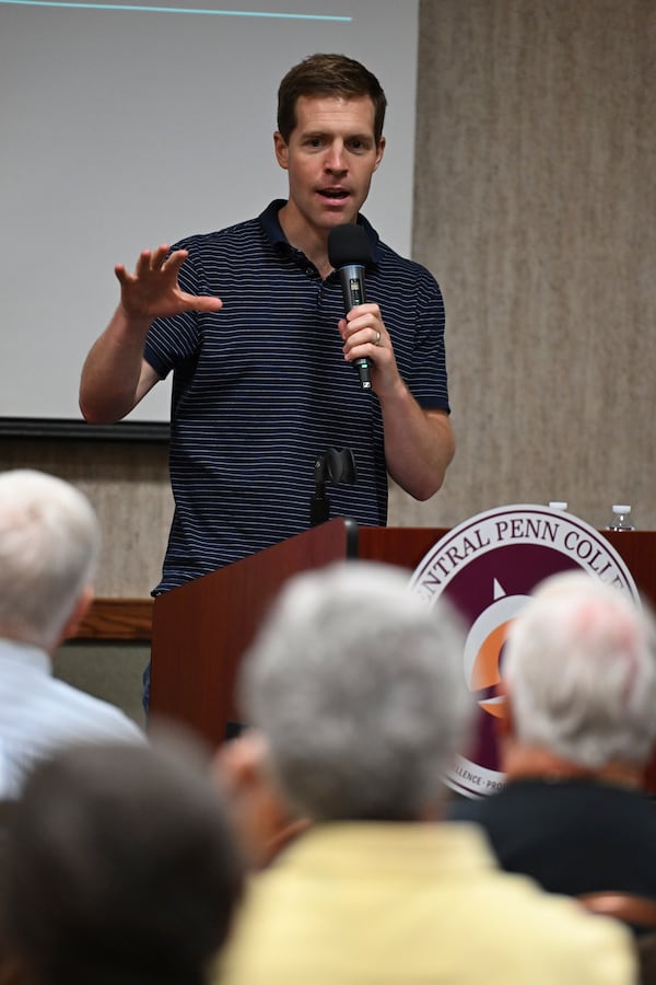 Conor Lamb speaks to the crowd at a town hall-style event organized by progressive groups at Central Penn College, Sunday, June 22, 2025, in Enola, Pa. (AP Photo/Marc Levy)