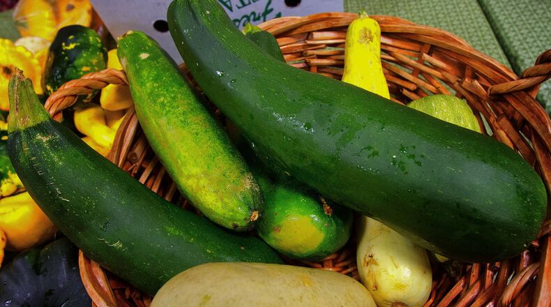 A pile of giant zucchini is available from Kai-Kai Farm at Palm Beach Gardens Summer GreenMarket at STORE in Palm Beach Gardens. (Photo by Libby Volgyes/Special to the Palm Beach Post)