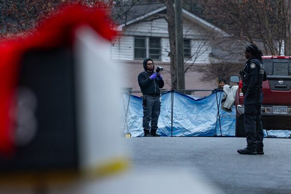 Atlanta police investigate a fatal shooting on Cornell Boulevard on Monday. (Ben Hendren for the AJC)
