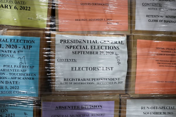 Boxes of election records are kept in a locked cage at the Fulton County Clerk’s Warehouse. These 2020 election records were not seized by the FBI in their raid in late January. (Arvin Temkar/AJC)