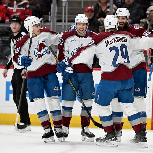 Colorado defenseman Brent Burns (84) celebrates with Colorado defenseman Sam Malinski (70), Colorado left wing Artturi Lehkonen (62) and Colorado center Nathan MacKinnon (29) after scoring a goal against Detroit in the first period of an NHL hockey game Saturday, Jan. 31, 2026 in Detroit. (AP Photo/Lon Horwedel)