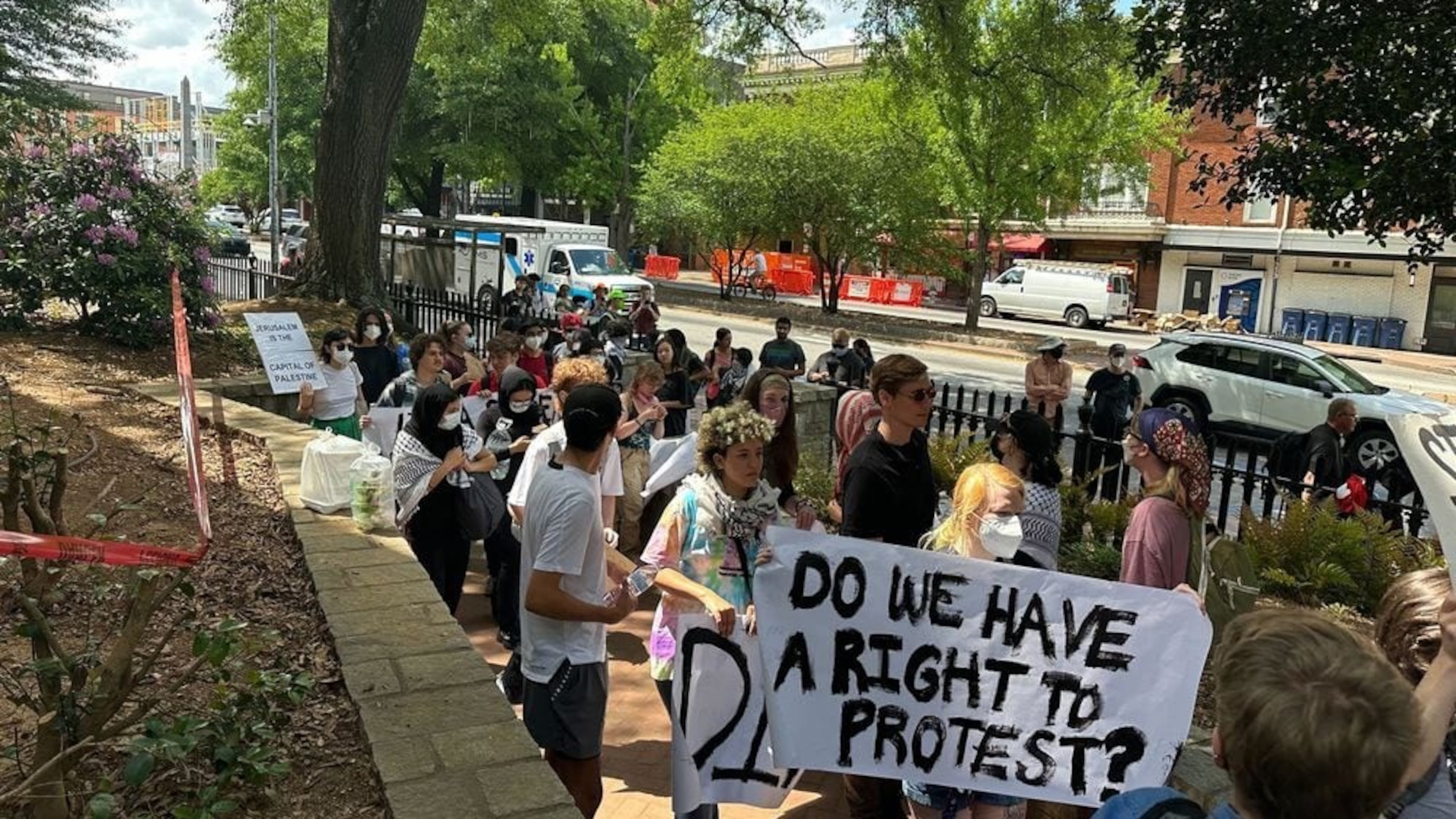 Demonstrators protesting the Israel-Hamas war in Gaza carry a banner asking "Do we have a right to protest?" at the University of Georgia in 2024. The University System of Georgia on July 1 published its annual free speech report, which stated that schools prepared extensively for campus protests. (Fletcher Page/AJC file photo)