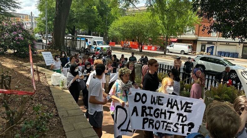 Demonstrators protesting the Israel-Hamas war in Gaza carry a banner asking "Do we have a right to protest?" at the University of Georgia in 2024. The University System of Georgia on July 1 published its annual free speech report, which stated that schools prepared extensively for campus protests. (Fletcher Page/AJC file photo)