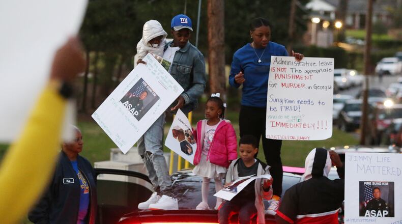 3/19/19 - Atlanta  - People protest the way the death of 21-year-old Jimmy Atchison was handled by officials outside of a town hall hosted by Atlanta Mayor Keisha Lance Bottoms at Cascade United Methodist Church in Atlanta, Georgia on Tuesday, March 19, 2019. EMILY HANEY / emily.haney@ajc.com