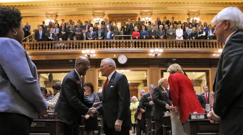 Gov. Nathan Deal greets legislators before his 2016 "State of the State" address. At the Capitol, the big topic these days is who will succeed him. (AJC Photo / Bob Andres)