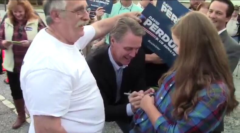 A screenshot from the second David Perdue signature video