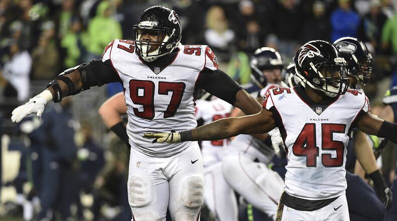Falcons defensive tackle Grady Jarrett (97) and middle linebacker Deion Jones (45) react after the Seattle Seahawks missed a long field goal attempt in the last minute of the fourth quarter at CenturyLink Field on Nov. 20, 2017 in Seattle.