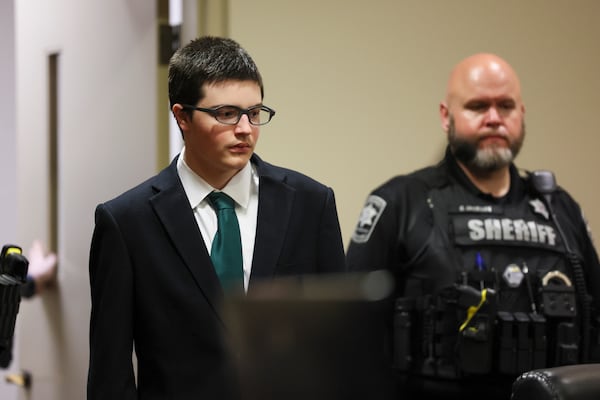 Colt Gray, the 16-year-old who pleaded guilty in the Apalachee High School shooting, is led in to court for his sentencing hearing Monday, July 27, 2026. (Jason Getz/AJC)
