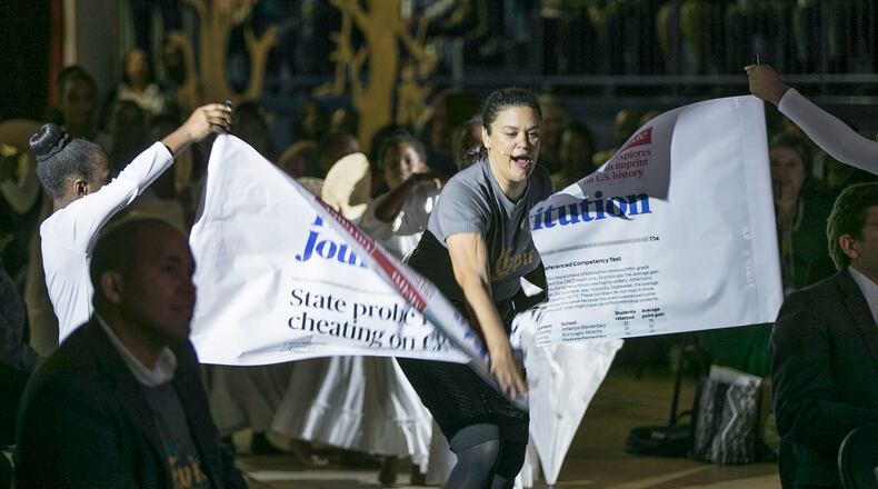 Atlanta Public Schools Superintendent Meria Carstarphen karate chops through a banner with an Atlanta Journal-Constitution article about the Atlanta schools cheating scandal as she entered the 2019 State of the District event. She delivered her final State of the District address at the newly renovated Harper-Archer Elementary School. The theme of this year's address was"The Epic of APS." Bob Andres / robert.andres@ajc.com