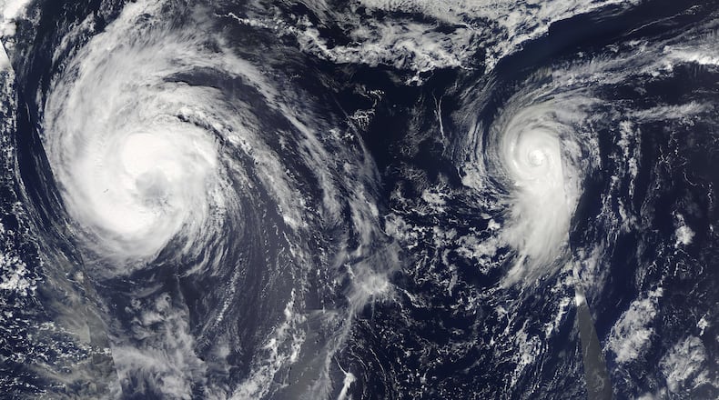 An image created by two NASA satellite images of Tropical Storm Leslie and Hurricane Michael spinning in the Atlantic Ocean in September 2018. This year’s Atlantic hurricane season should be “near normal,” government forecasters announced on May 23, 2019, with the likelihood of nine to 15 named storms, and two to four major Category 3 hurricanes with winds of 111 miles per hour or greater. NASA/Goddard via The New York Times