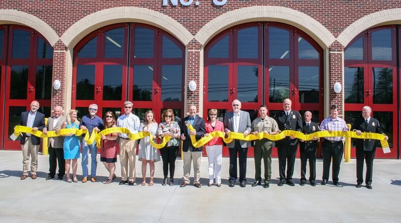 Forsyth officials took part in a hose uncoupling ceremony at the dedication of their newest fire station. (courtesy Forsyth County)