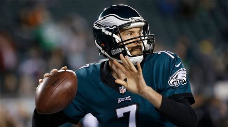 FILE - This Dec. 26, 2015 file photo shows Philadelphia Eagles' Sam Bradford warming up before an NFL football game against the Washington Redskins in Philadelphia. Bradford has returned for voluntary workouts with the Eagles after asking for a trade last month. Bradford issued a statement Monday, May 9, 2016 saying he's "committed" to his teammates and the organization. (AP Photo/Michael Perez, file)