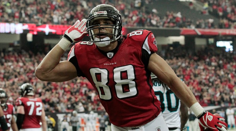 Atlanta Falcons tight end Tony Gonzalez reacts after scoring a touchdown against the Carolina Panthers in the first half of an NFL football game at the Georgia Dome in Atlanta Sunday, Jan. 2, 2011. (AP Photo/Dave Martin)