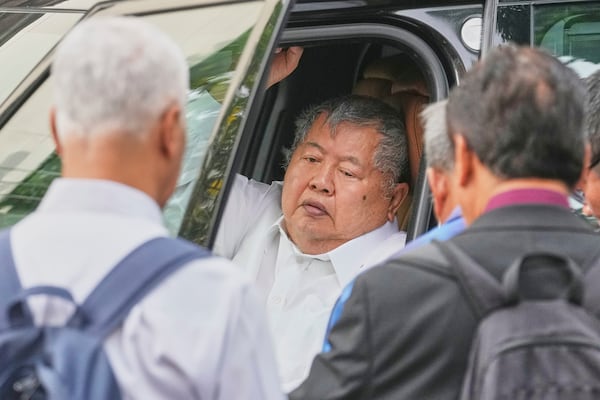 Premchai Karnasuta, the president of Italian-Thai Development Co arrives at Bang Sue Police Station in Bangkok, Thailand, Friday, May 16, 2025 to surrender to police on criminal negligence charges for the collapse of a Bangkok high-rise during a March 28 earthquake. (AP Photo/Sakchai Lalit)