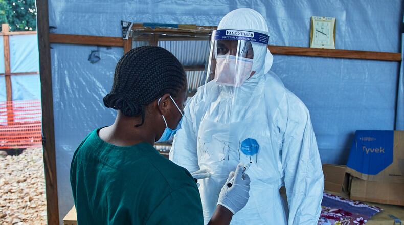 Health workers interact at the Evangelical Medical Center, in Bunia, eastern Congo, Friday, July 3, 2026, where Ebola clinical trials are scheduled to take place. (AP Photo/Dirole Lotsima Dieudonne)