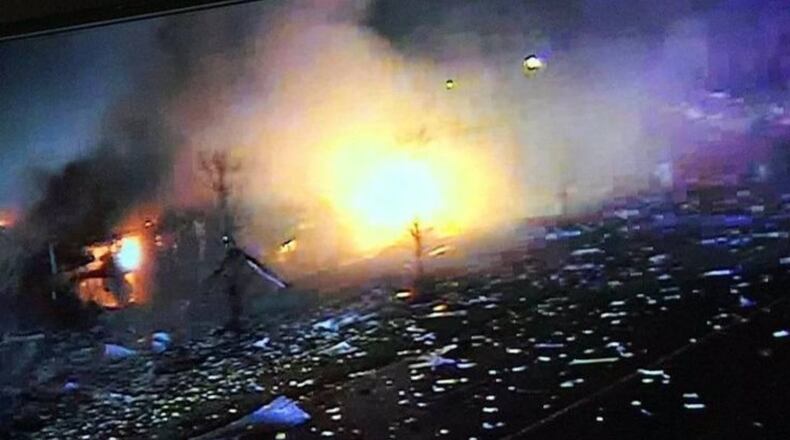 Fire and debris can be seen after an explosion in Waukegan, Illinois, late Friday.