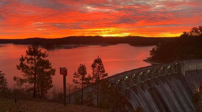 The sun rises over the Etowah River dam at Allatoona Lake. Park management is seeking candidates to bid on a seasonal park attendant position at Sweetwater Campground on the lake. U.S. ARMY CORPS OF ENGINEERS via Facebook