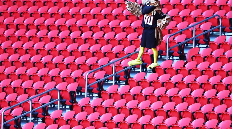 091320 Atlanta: Atlanta Falcons mascot Freddie Falcons cheers the team from the empty seats in Mercedes-Benz Stadium against the Seattle Seahawks in a NFL football game on Sunday, Sept. 13, 2020 in Atlanta. “Curtis Compton / Curtis.Compton@ajc.com”