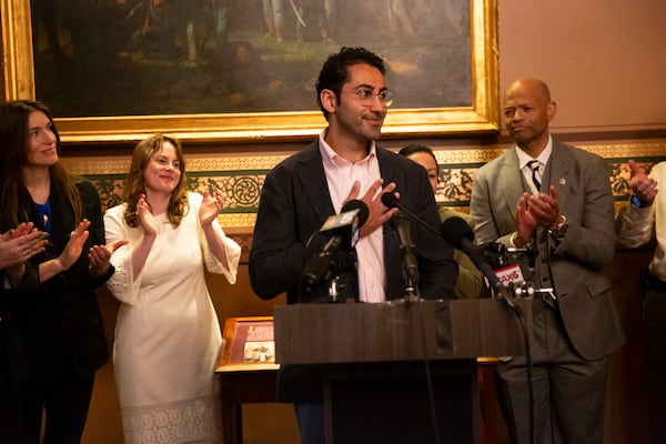 Mohsen Mahdawi, center, speaks during a press conference announcing the launch of the Vermont Immigration Legal Defense Fund in the Cedar Creek Reception Room at the Vermont State House on Thursday, May 8, 2025, in Montpelier, Vt. (AP Photo/Alex Driehaus)