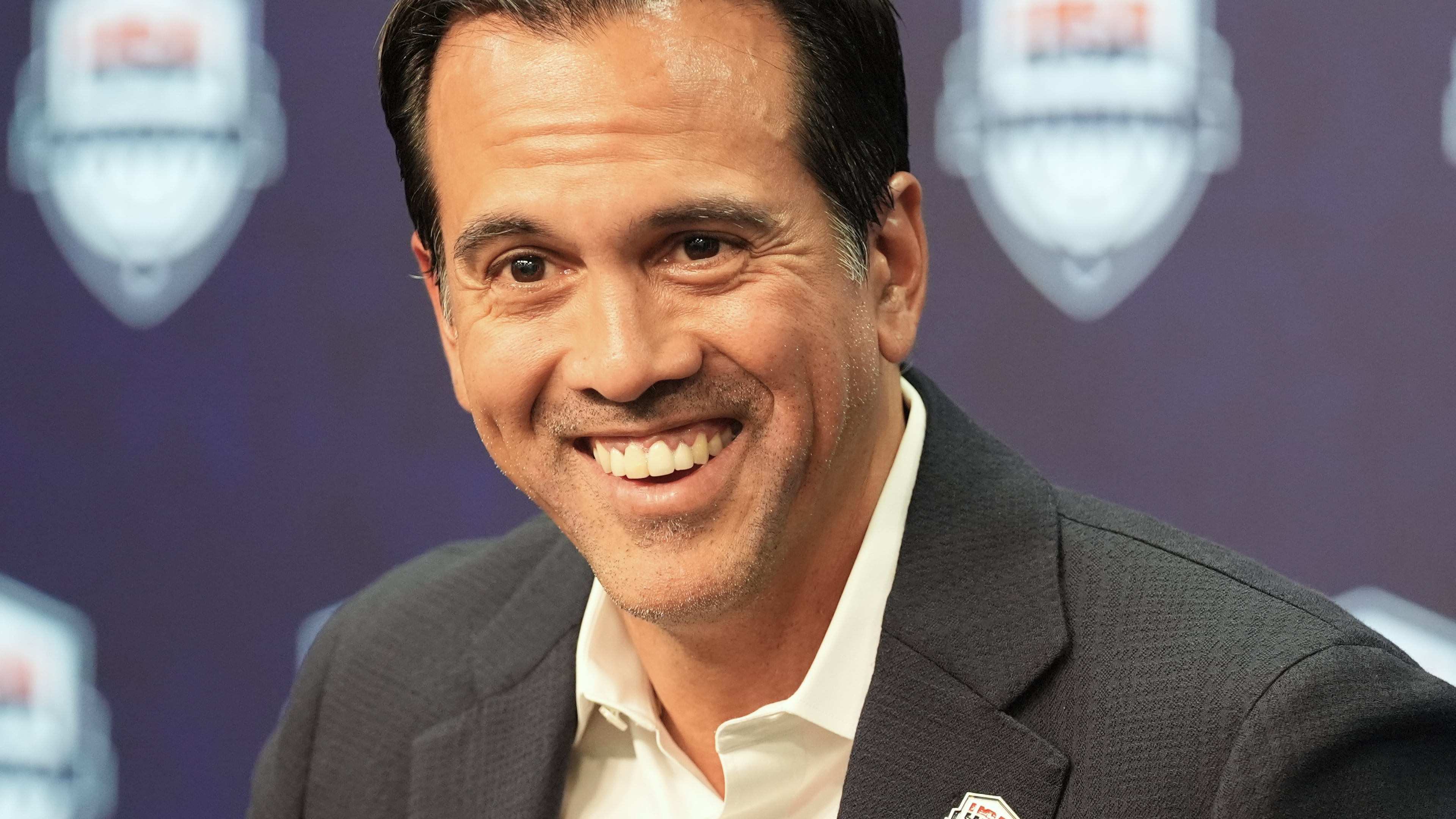 Erik Spoelstra, the head coach of the Miami Heat, smiles as he announces that he has accepted the USA Basketball men's national team head coach position during a news conference Thursday, Oct. 16, 2025, in Miami. (AP Photo/Marta Lavandier)