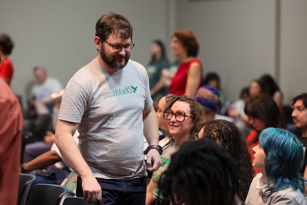 Matthew Talbert, a parent of a Henderson Mill Elementary student, walks back to his family after he spoke to the DeKalb County School Board during the public comment portion of the board meeting on Monday, April 20, 2026, in Stone Mountain. (Jason Getz/AJC)