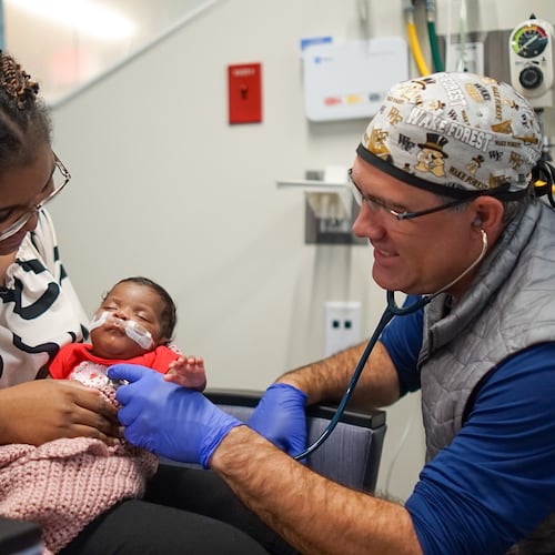 Dr. Brad Buckler examines Tianna Nunnally’s baby, Sky, at the Memorial Health University Medical Center’s Dwaine and Cynthia Willett Children’s Hospital neonatal intensive care unit in Savannah. (Courtesy of Tre Windom)