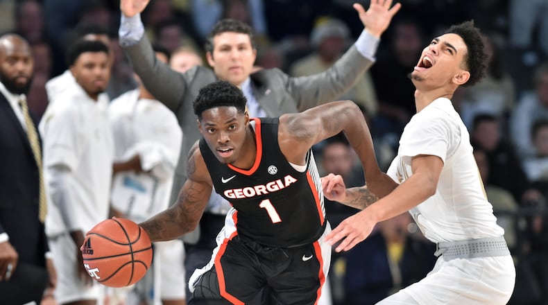 Georgia guard Teshaun Hightower (1) drives against Georgia Tech guard Michael Devoe (0) in the second half at Georgia Tech's McCamish Pavilion on Saturday, December 22, 2018. Georgia won 70-59 over the Georgia Tech. HYOSUB SHIN / HSHIN@AJC.COM