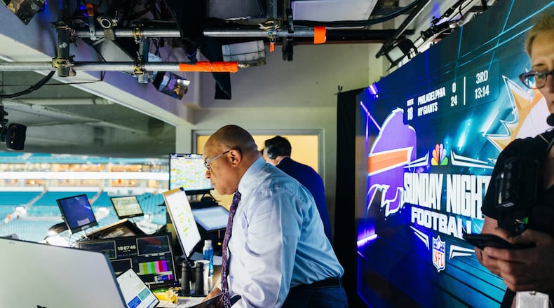 Sports commentator Mike Tirico rehearses in the broadcast booth during the Miami Dolphins vs. Buffalo Bills NFL game at Hard Rock Stadium in Miami Gardens, Fla. on Jan. 7, 2024. Alfonso Duran/The New York Times)