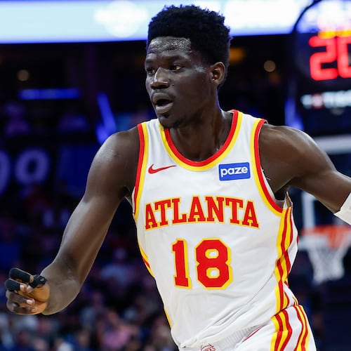 FILE - Atlanta Hawks forward Mouhamed Gueye (18) drives against the Orlando Magic during the first half of an NBA basketball game Wednesday, April 1, 2026, in Orlando, Fla. (AP Photo/Kevin Kolczynski, File)