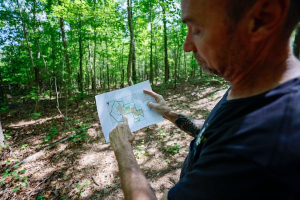 Coweta County resident Phil Sofolo and his wife Laura Beth say they expect the Project Sail data center campus will bring a security fence and buzzing to the border of their backyard. (Miguel Martinez/AJC)